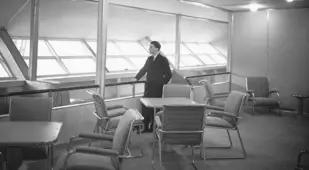 Man Standing Inside The Hindenburg Lounge