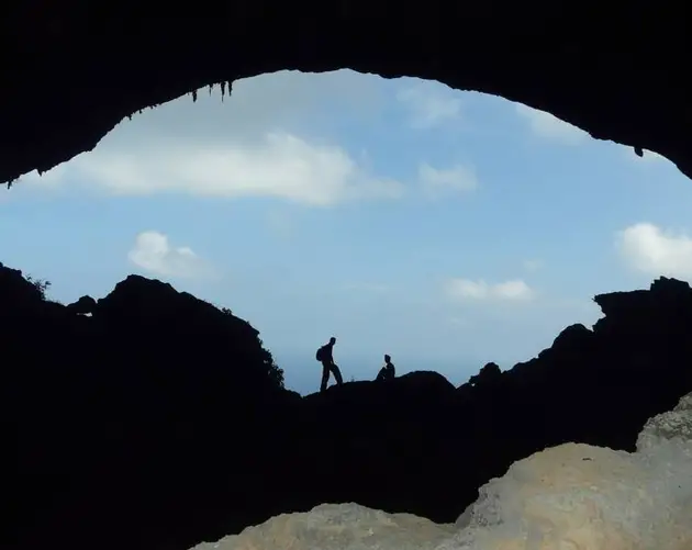 Silhouettes In Cave