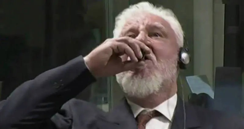 War Criminal Drinks Poison And Dies After Being Ruled Guilty [VIDEO]