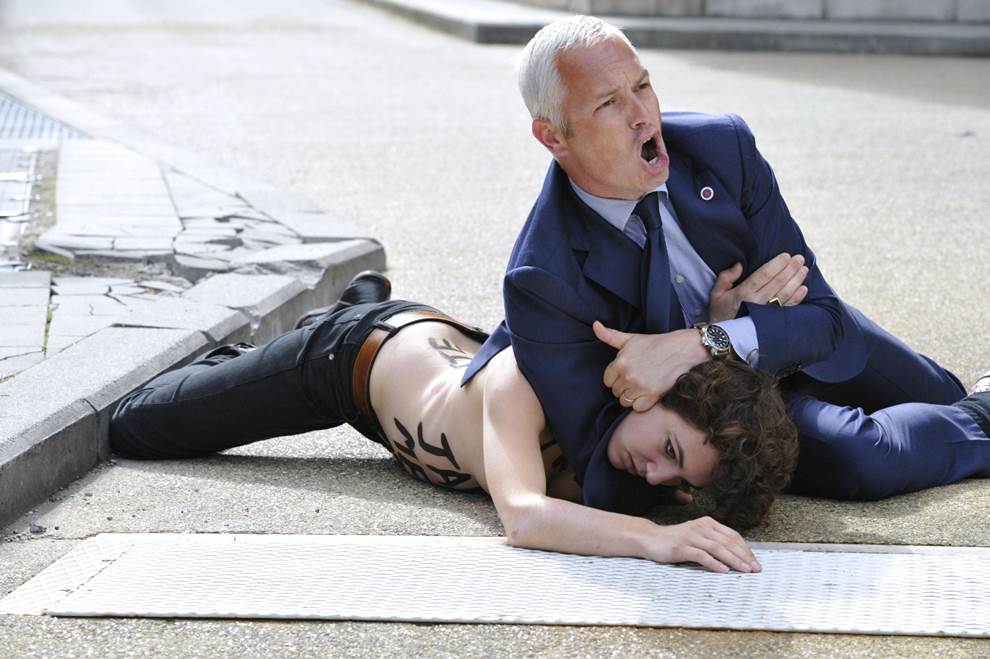 Femen Activist Tackled In Brussels