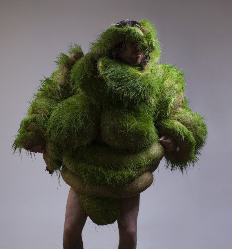 Man Covered in Grass
