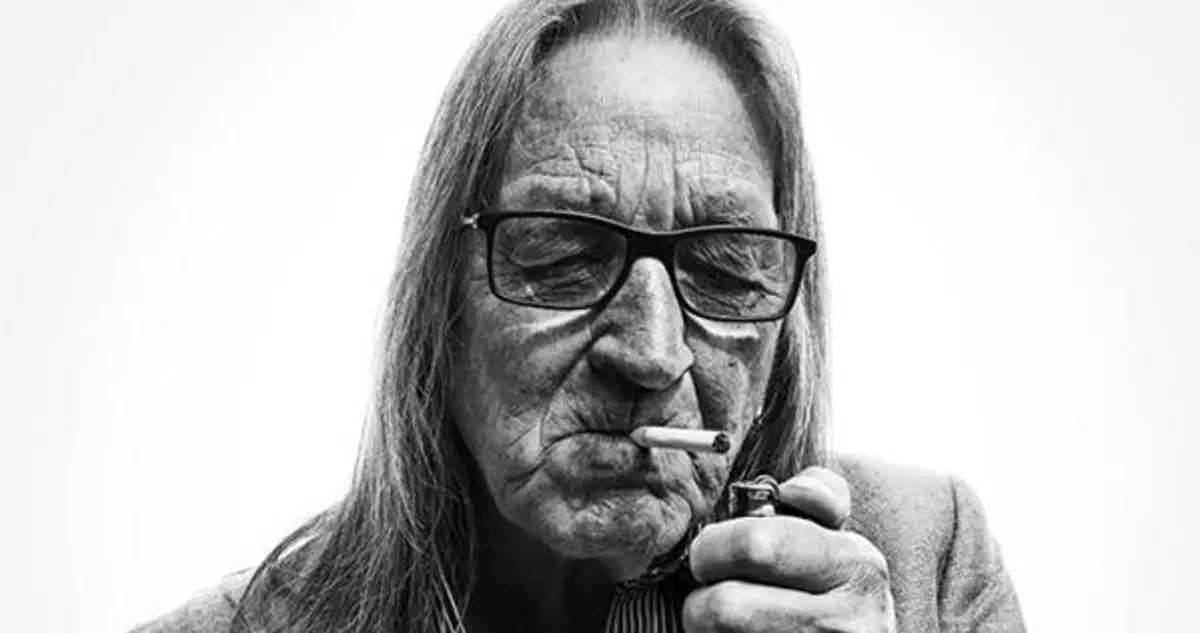 George Jung smoking a cigarette (or weed)
