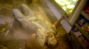 Ash Covered Man Lies Down In Deli