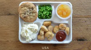 School lunches from the United States: Fried chicken nuggets, canned peas, potatoes