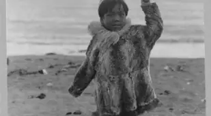 Eskimo Boy On Beach