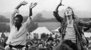 Hippies Dancing At Festival
