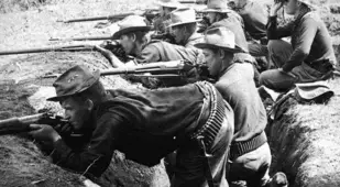 Soldiers Fire From Trenches