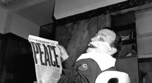 Man Shaving Reading Newspaper