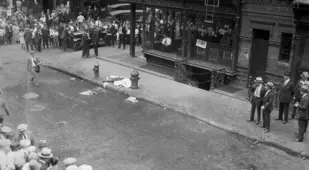 Victim Lying In Street Citizens Nearby
