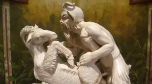 Man having sex with a goat statue