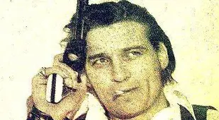 Waylon Jennings with a gun