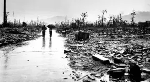 Two People Walk Through Devastated Hiroshima