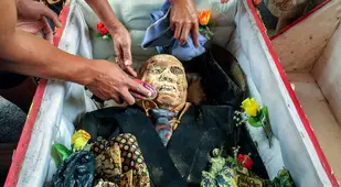 Cleaning Off Toraja Mummy