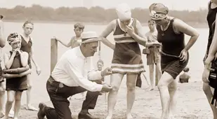 Man Measuring Flappers' Bathing Suits