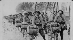 World War I Soldiers Stand With Bikes