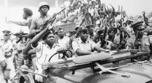 Idi Amin Drives Military Jeep
