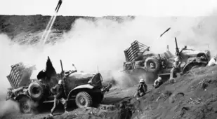American Jeeps Firing Rockets At Japanese Forces