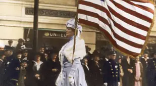 Color Woman In White Marches With American Flag