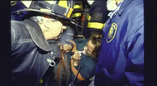 Firefighters Helping A Woman During The 1993 World Trade Center Bombing