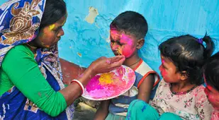 Woman Painting Child's Face