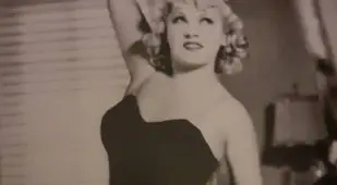 Mae West Lifting Weights