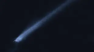 Asteroid And Trailing Debris