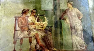 Woman Playing A Lyre