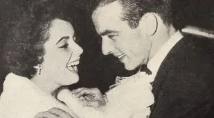 Elizabeth Taylor Fixing Montgomery Clift's Tie