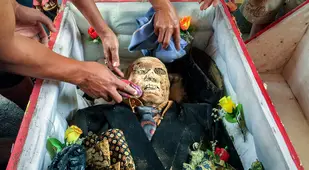 Cleaning Off Toraja Mummy