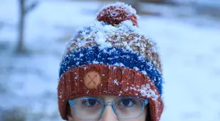 Boy Covered In Snow