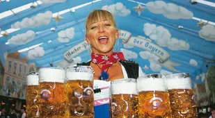 Waitress Carries Beer Steins