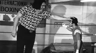Andre The Giant Next To A Boxer