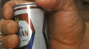 Holding A Beer Can