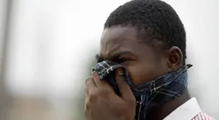 Man Covering Face