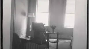 Woman In Living Room Tenement Building