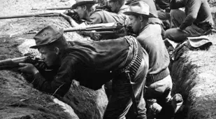 Soldiers Fire From Trenches