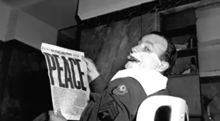 Man Shaving Reading Newspaper