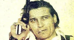 Waylon Jennings with a gun
