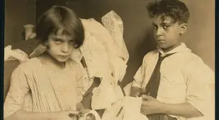 Boy And Girl Working With Lace