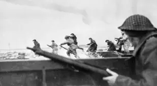 Soldiers Charge The Beach During D-Day Invasion