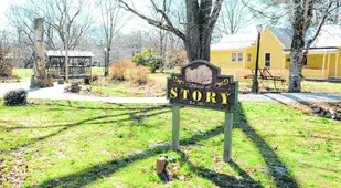 Yellow House Story Sign