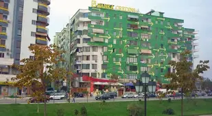 Arrows Painted On Green Building