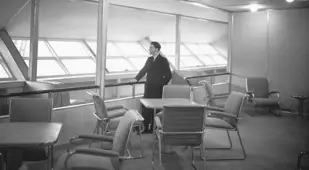 Man Standing Inside The Hindenburg Lounge