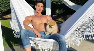 Justin Jedlica On Hammock With Dog