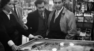 Pinball Players In A Parisian Cafe