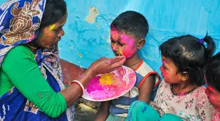 Woman Painting Child's Face