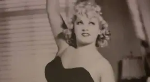 Mae West Lifting Weights