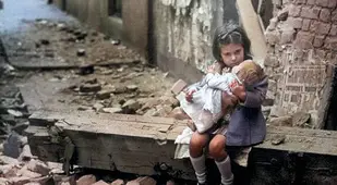 A Girl Holding A Doll