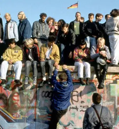 People Atop Berlin Wall Featured