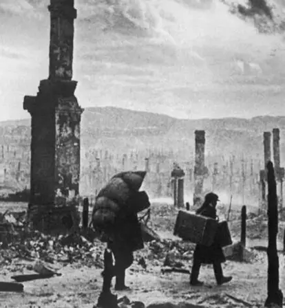 People Walking Through Bombed City